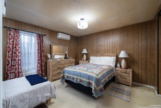 bedroom featuring light carpet, a textured ceiling, wood walls, and a wall unit AC