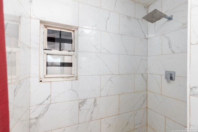 bathroom with a tile shower