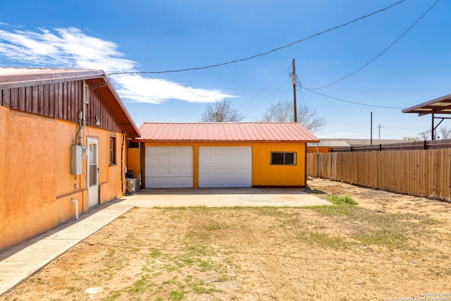 detached garage with fence