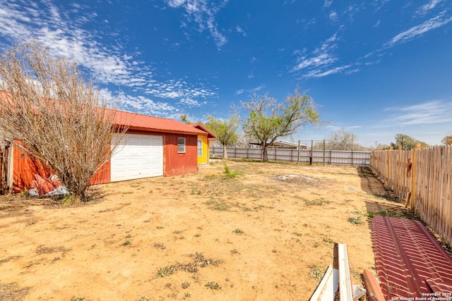 view of yard with an outdoor structure and fence private yard