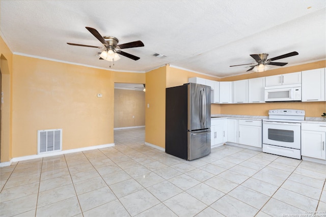 kitchen featuring visible vents, white appliances, and ornamental molding