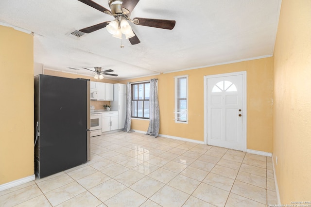 interior space with visible vents, baseboards, and light tile patterned flooring