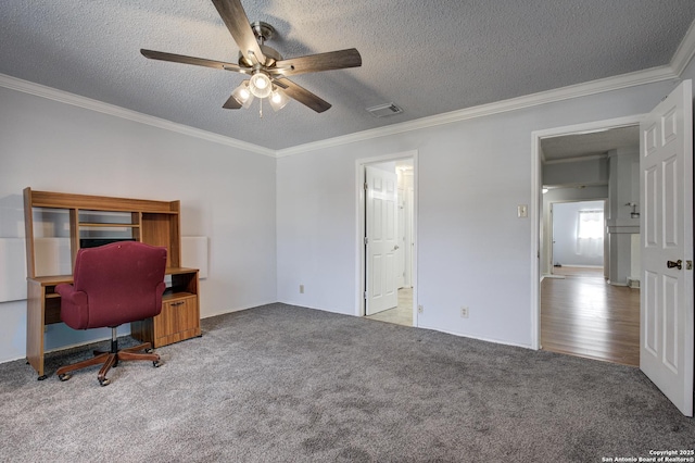 carpeted home office with visible vents, a textured ceiling, crown molding, and a ceiling fan