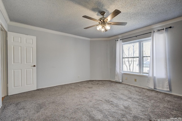 carpeted spare room featuring a textured ceiling, ceiling fan, and crown molding