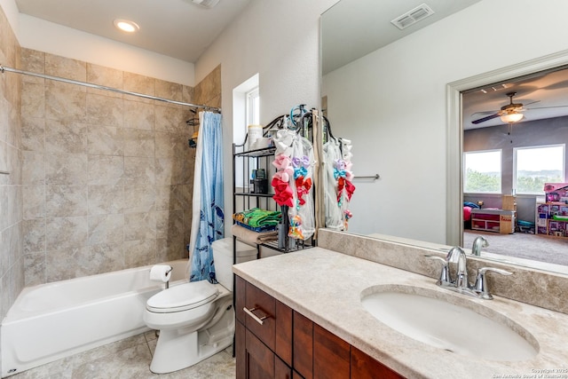 bathroom featuring vanity, visible vents, shower / bath combination with curtain, tile patterned floors, and toilet