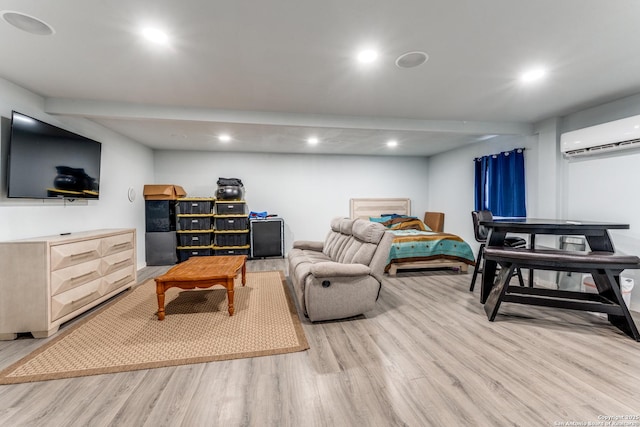 living area featuring recessed lighting, light wood finished floors, and a wall mounted AC