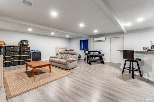 living room featuring beam ceiling, wood finished floors, a wall unit AC, recessed lighting, and baseboards