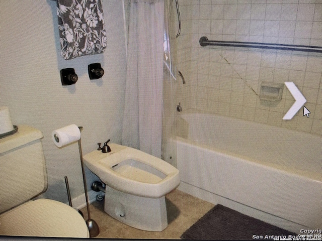 full bath with toilet and shower / tub combo with curtain