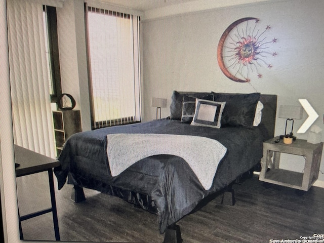 bedroom featuring wood finished floors