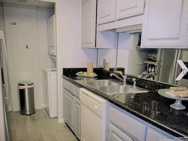 kitchen featuring white cabinets, white dishwasher, and a sink