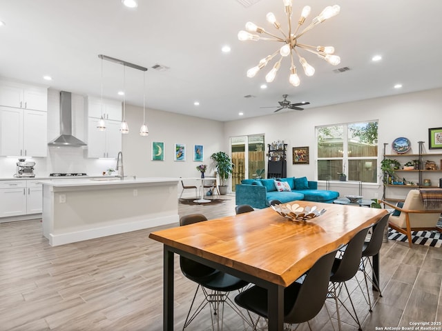 dining space with recessed lighting, visible vents, light wood-style floors, and ceiling fan