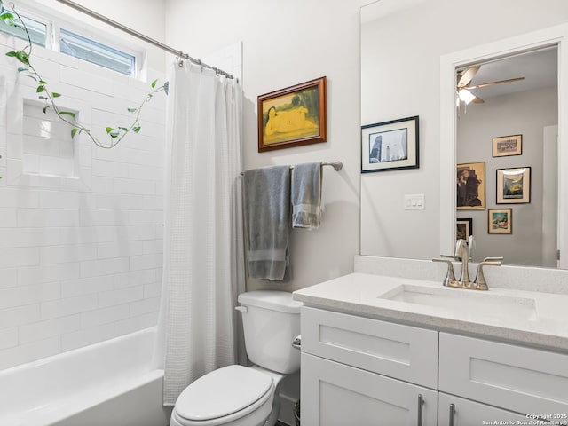 full bath with a ceiling fan, shower / bath combo with shower curtain, toilet, and vanity