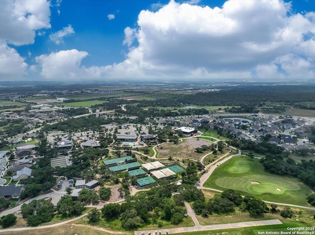 bird's eye view with view of golf course