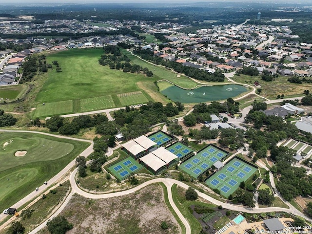 birds eye view of property featuring a residential view, a water view, and view of golf course