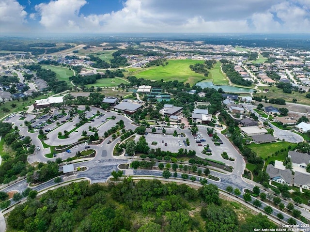 drone / aerial view with a residential view and a water view