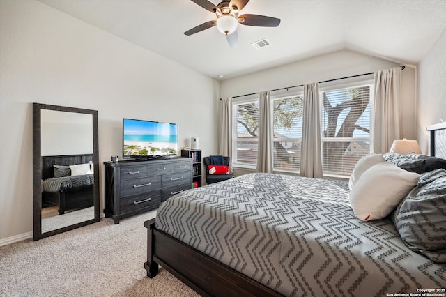 bedroom with visible vents, a ceiling fan, baseboards, light colored carpet, and vaulted ceiling