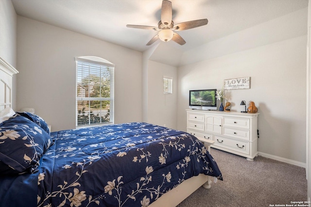 carpeted bedroom featuring a ceiling fan and baseboards