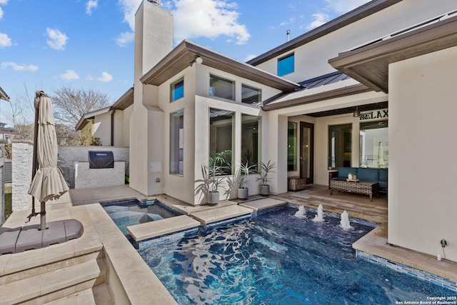 view of swimming pool with a patio area, an outdoor living space, and an in ground hot tub