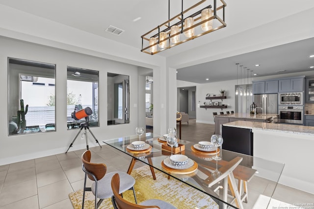 dining space with light tile patterned floors, visible vents, baseboards, and recessed lighting