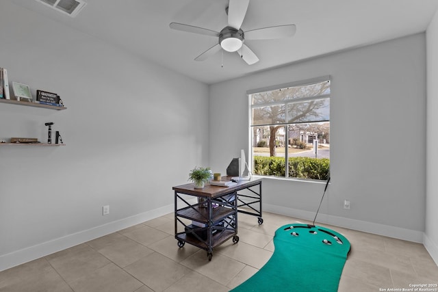 office space featuring visible vents, baseboards, ceiling fan, and light tile patterned flooring