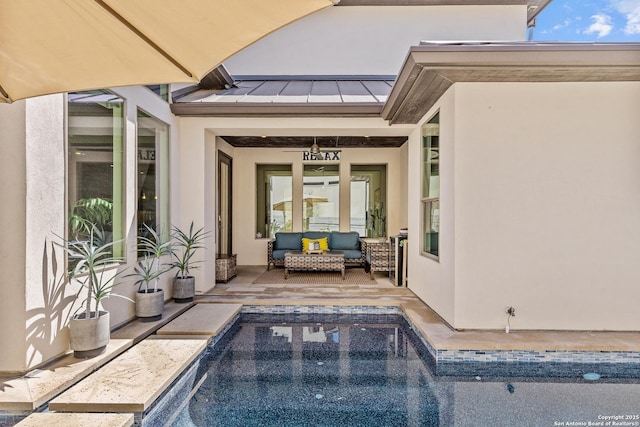 exterior space with an outdoor hangout area and a patio