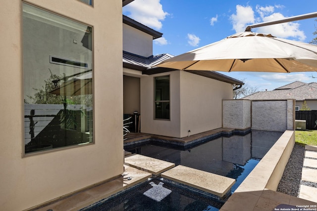 view of pool featuring a patio area and fence