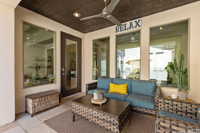 sunroom / solarium featuring wood ceiling and ceiling fan