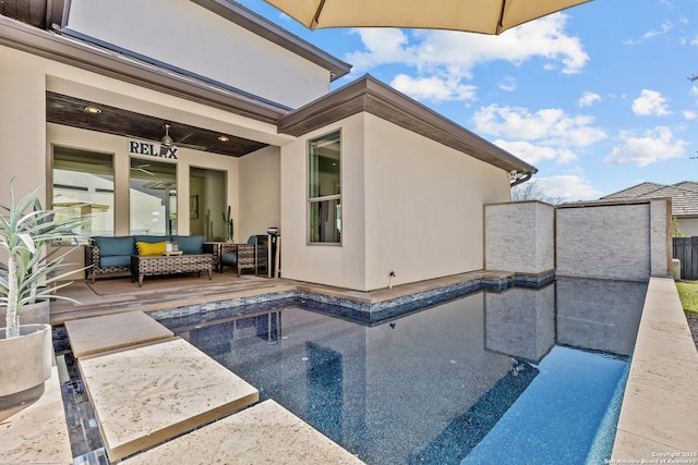 view of pool with a patio area, outdoor lounge area, and fence