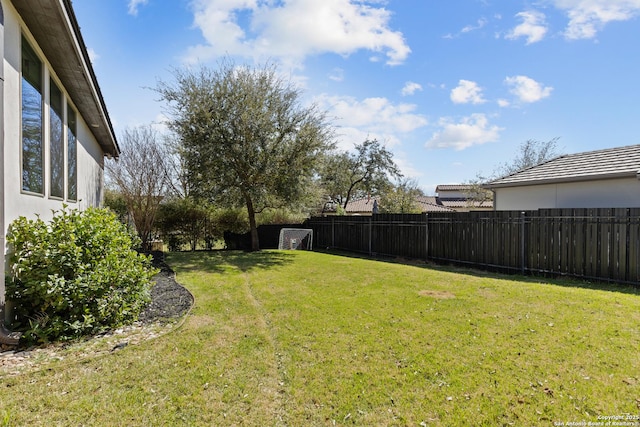 view of yard featuring a fenced backyard