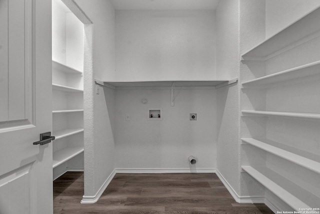 laundry room with hookup for a washing machine, baseboards, hookup for an electric dryer, laundry area, and dark wood-style flooring