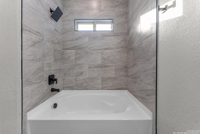 full bathroom featuring a textured wall