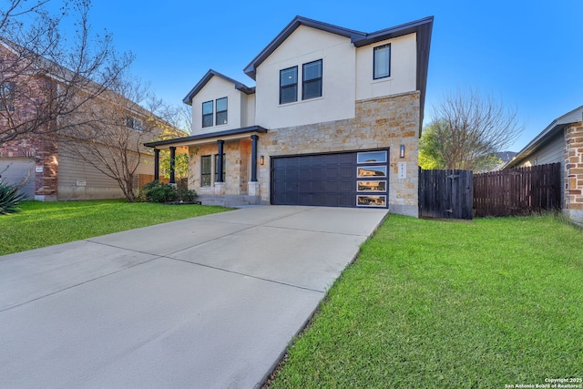 modern home featuring a front lawn, fence, concrete driveway, stucco siding, and stone siding