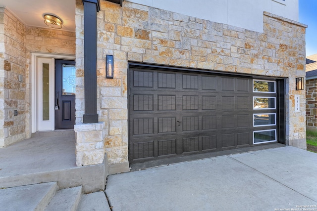 garage featuring driveway