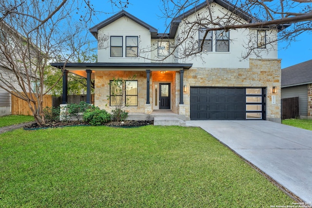 view of front of property featuring stucco siding, a front lawn, stone siding, fence, and an attached garage