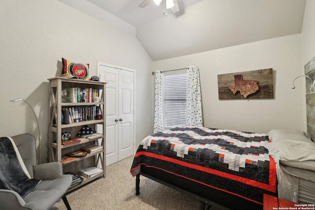 bedroom with vaulted ceiling, a closet, and ceiling fan