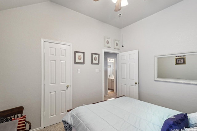 bedroom with light carpet, ceiling fan, and vaulted ceiling