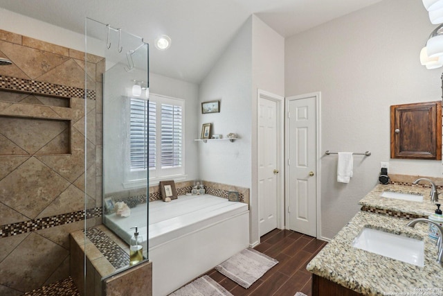 full bathroom featuring wood tiled floor, a stall shower, and a sink