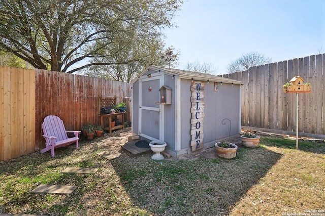 view of shed with a fenced backyard