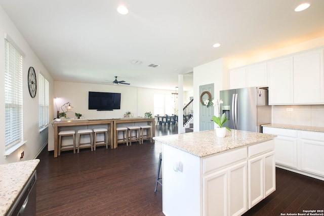 7611 Ponderosa Pne, Boerne, TX 78015 - kitchen featuring a ceiling fan, dark wood finished floors, appliances with stainless steel finishes, and a healthy amount of sunlight
