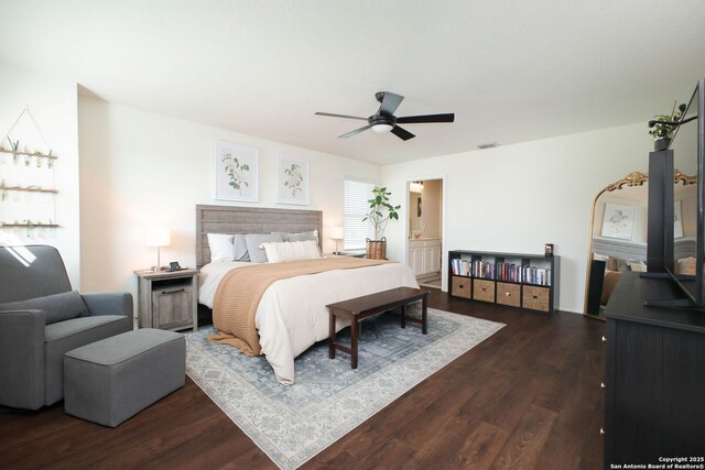 7611 Ponderosa Pne, Boerne, TX 78015 - bedroom featuring ceiling fan, ensuite bath, dark wood-type flooring, and visible vents