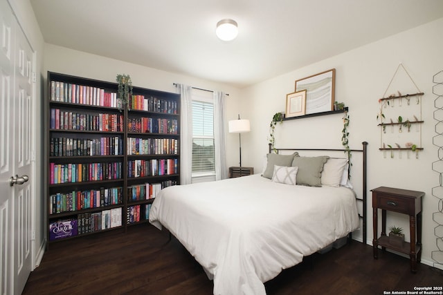 7611 Ponderosa Pne, Boerne, TX 78015 - bedroom with baseboards and wood finished floors