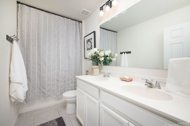 7611 Ponderosa Pne, Boerne, TX 78015 - bathroom with visible vents, tile patterned flooring, toilet, and a sink