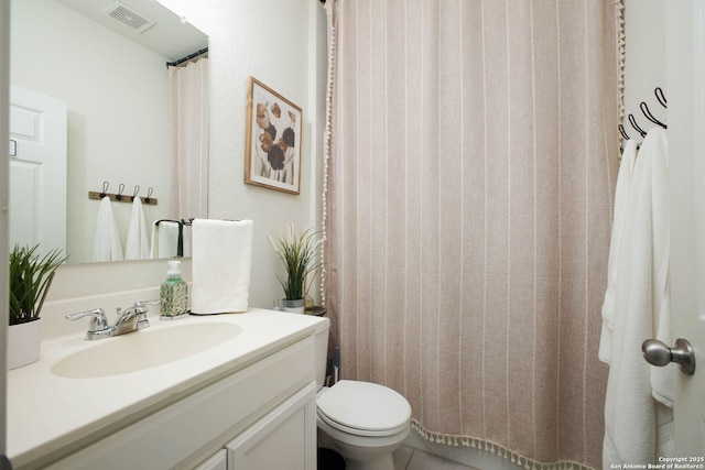 7611 Ponderosa Pne, Boerne, TX 78015 - bathroom featuring toilet, vanity, and visible vents