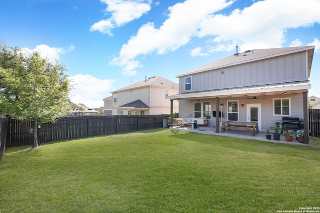 7611 Ponderosa Pne, Boerne, TX 78015 - back of house featuring a lawn, a fenced backyard, a ceiling fan, and a patio