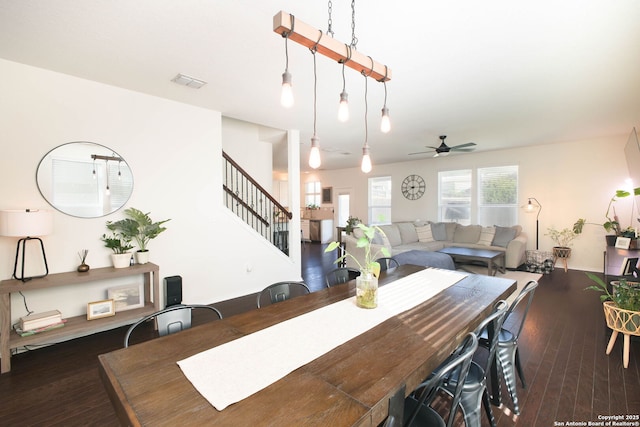 7611 Ponderosa Pne, Boerne, TX 78015 - dining room featuring wood-type flooring, visible vents, stairs, and ceiling fan
