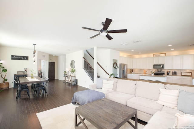7611 Ponderosa Pne, Boerne, TX 78015 - living area with recessed lighting, visible vents, a ceiling fan, stairs, and dark wood-style flooring
