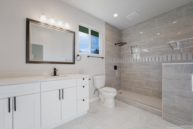 full bathroom featuring vanity, toilet, a walk in shower, and marble finish floor