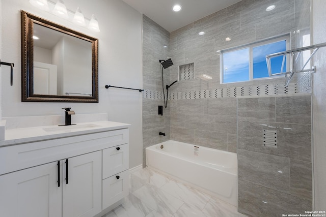 bathroom featuring recessed lighting, shower / bathtub combination, marble finish floor, and vanity