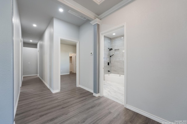 corridor with recessed lighting, wood finished floors, visible vents, and baseboards