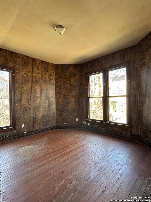 unfurnished room featuring hardwood / wood-style floors